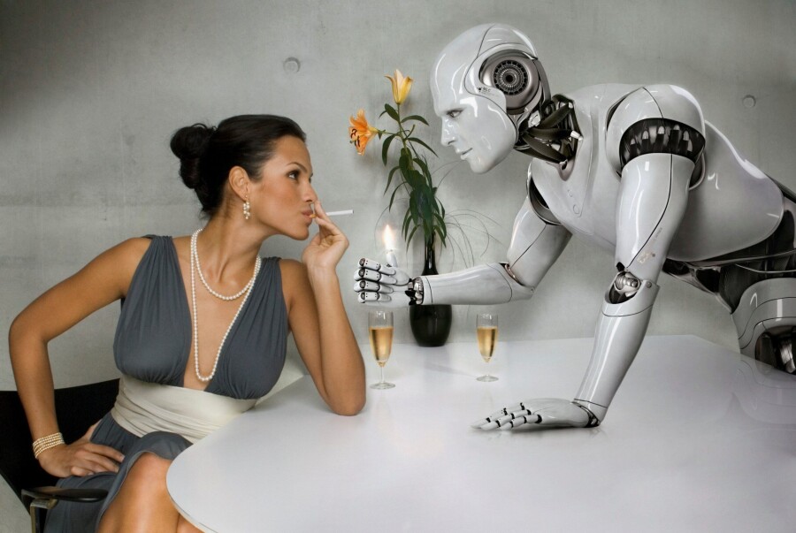 робот и девушка за столом